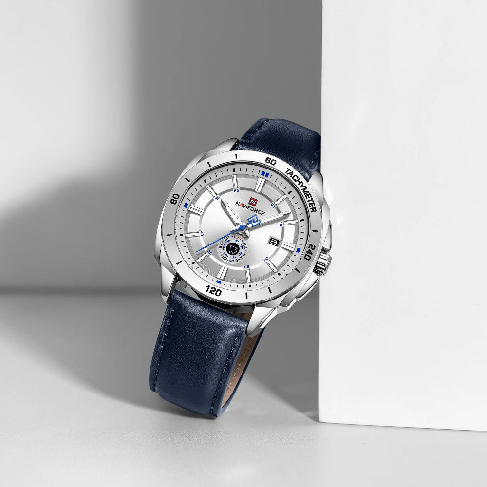 Wristwatch with blue strap and silver case on a light gray background
