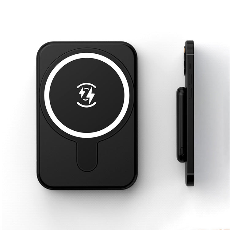 Black wireless charging pad with a logo on a white background