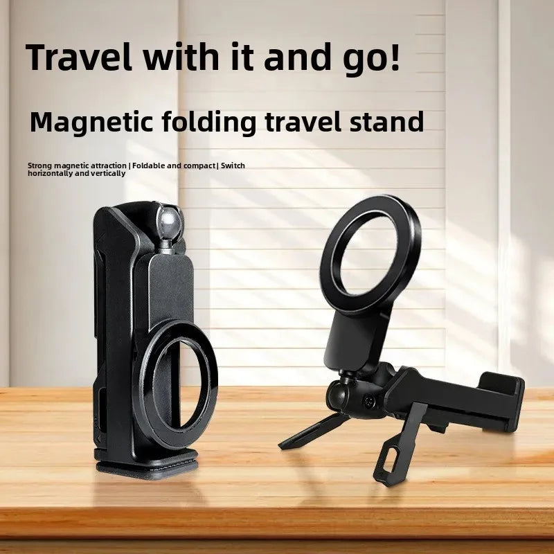 Black magnetic folding travel stand on a wooden surface with text about its features.