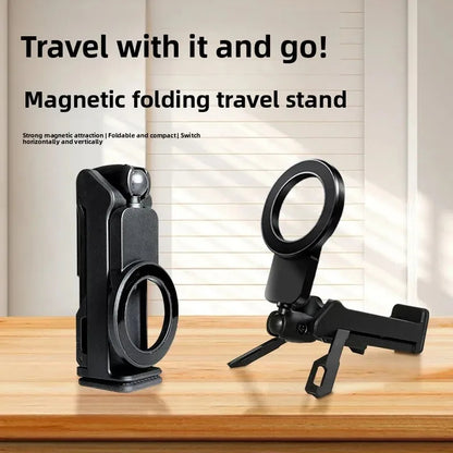 Black magnetic folding travel stand on a wooden surface with text about its features.