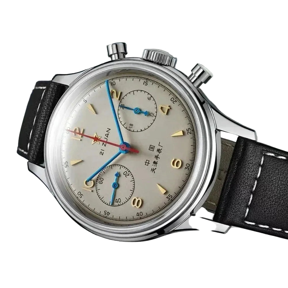 Vintage-style wristwatch with detailed face and black leather strap on a reflective surface.